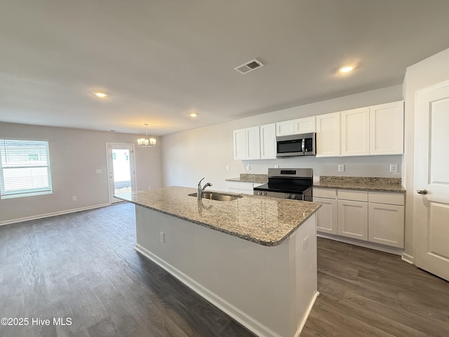 kitchen featuring white cabinetry, an island with sink, appliances with stainless steel finishes, and sink