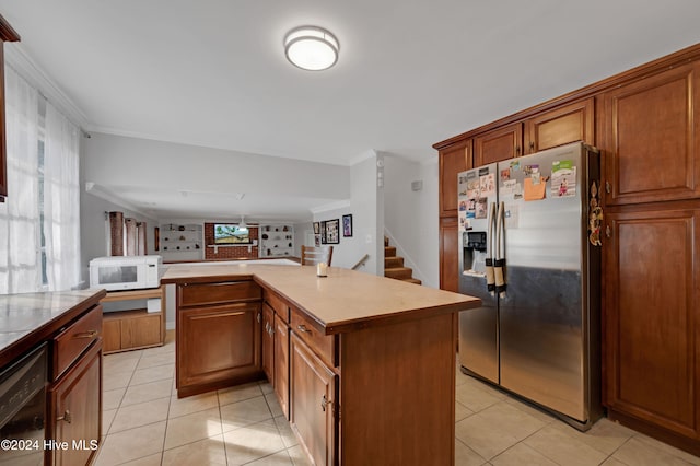 kitchen with crown molding, a kitchen island, a healthy amount of sunlight, and stainless steel refrigerator with ice dispenser