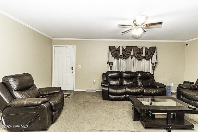 carpeted living room with ceiling fan and ornamental molding