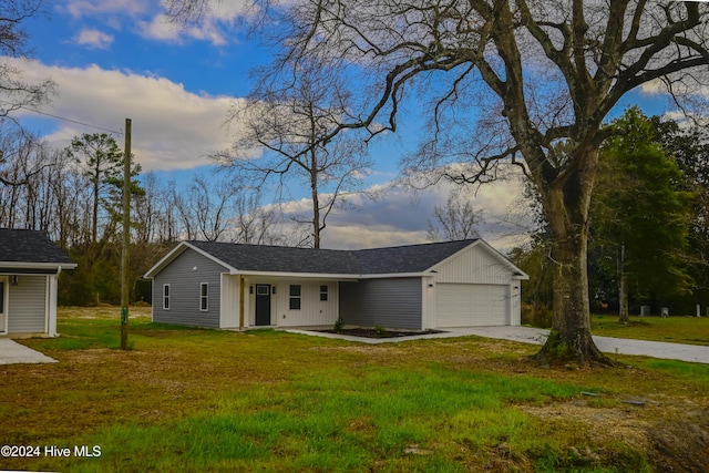 single story home with a front lawn and a garage