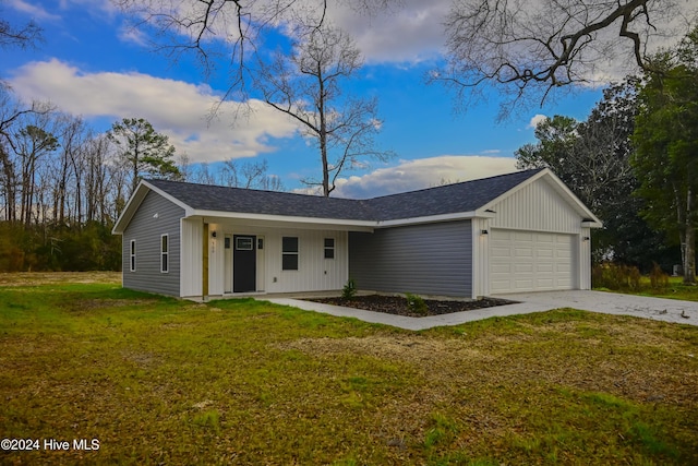 single story home featuring a front yard and a garage