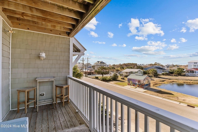 balcony featuring a water view