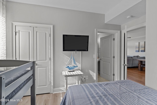 bedroom featuring a closet and light hardwood / wood-style floors