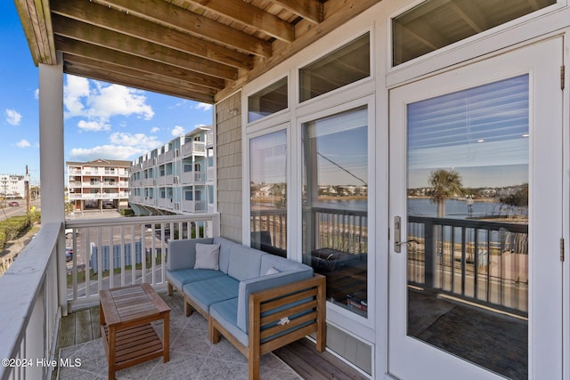 balcony featuring an outdoor hangout area and french doors