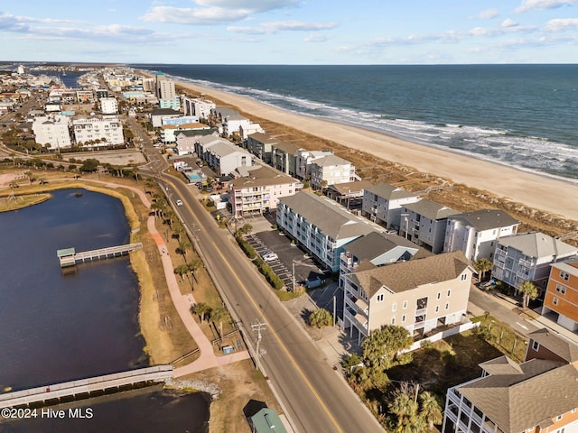 aerial view featuring a water view and a beach view