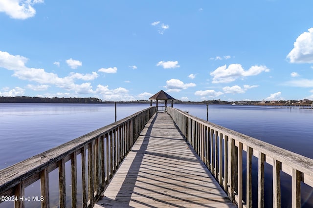 dock area featuring a gazebo and a water view