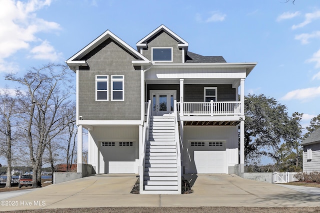 view of front of property featuring a garage and covered porch