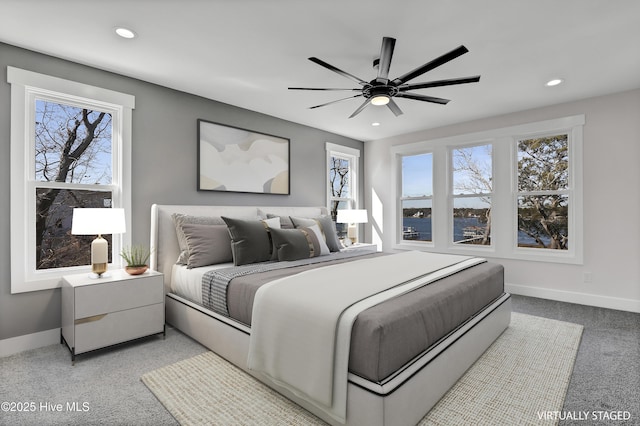 carpeted bedroom featuring ceiling fan