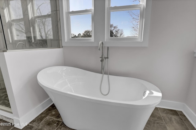 bathroom featuring separate shower and tub