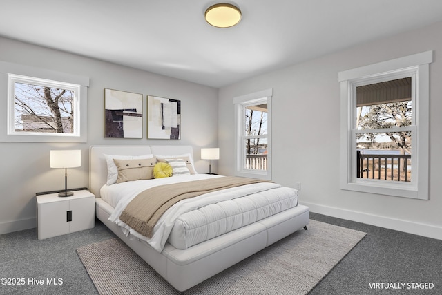 bedroom featuring dark colored carpet