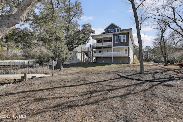 rear view of property featuring a balcony