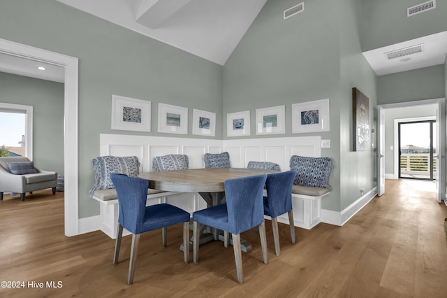 dining space featuring hardwood / wood-style floors, a healthy amount of sunlight, and breakfast area