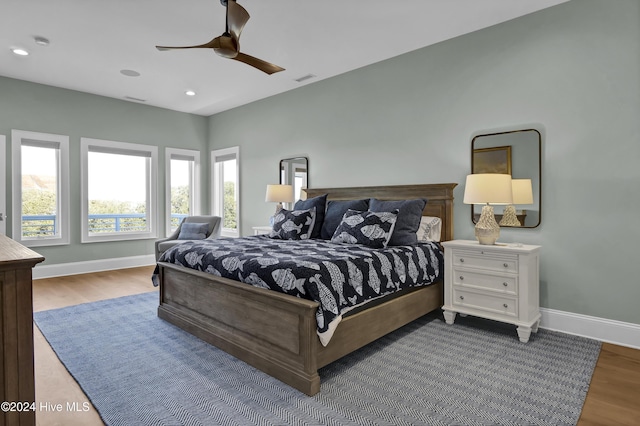 bedroom featuring ceiling fan and hardwood / wood-style floors