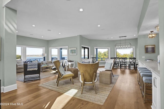 dining room with an inviting chandelier and light wood-type flooring