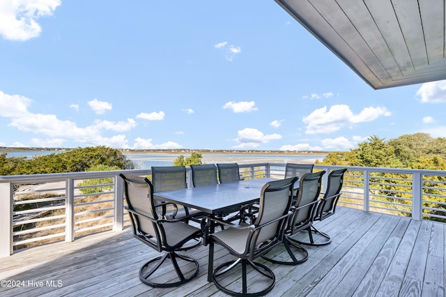 wooden deck featuring a water view