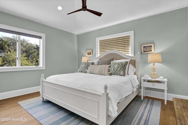 bedroom featuring ceiling fan and hardwood / wood-style floors