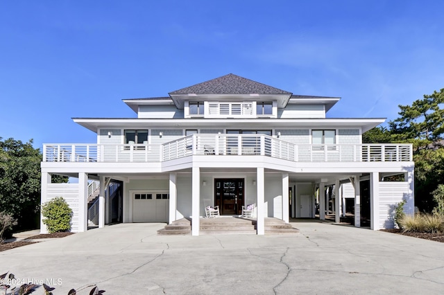 view of front facade with a carport and a garage