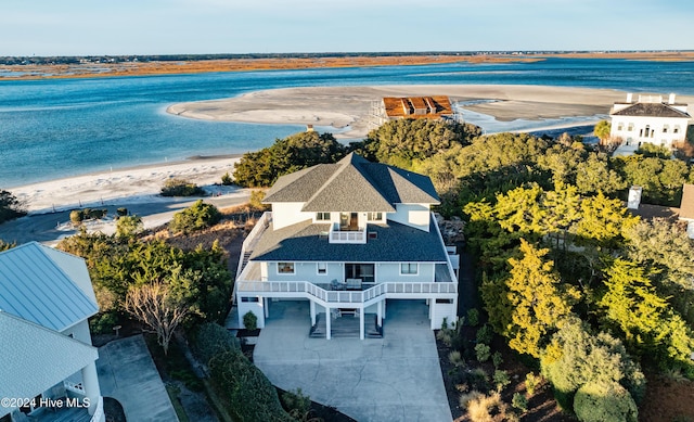 birds eye view of property featuring a water view and a view of the beach