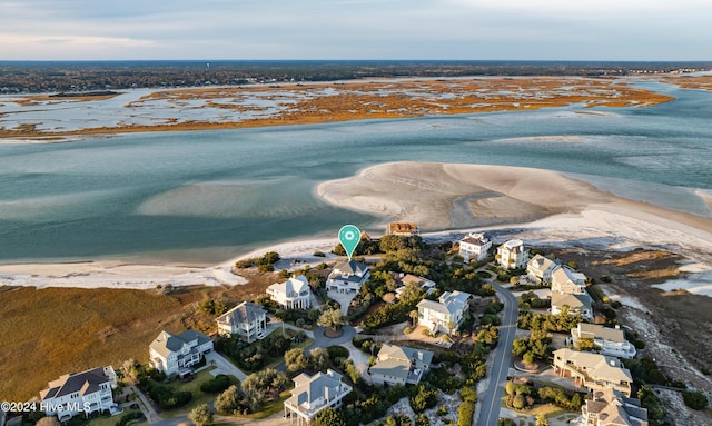 aerial view with a water view and a view of the beach