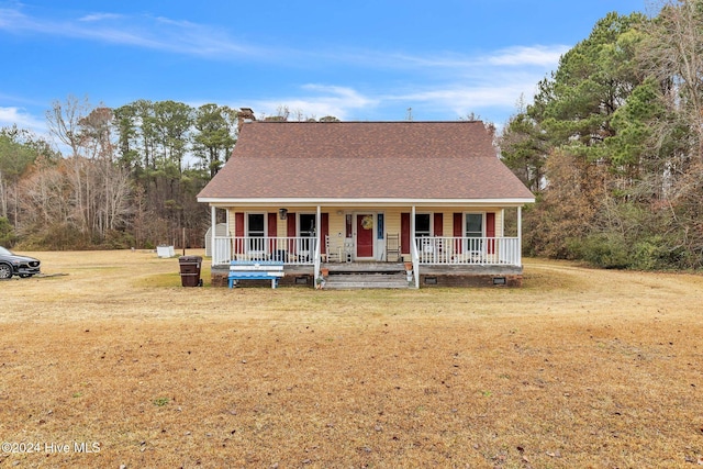 view of front of house featuring covered porch and a front lawn