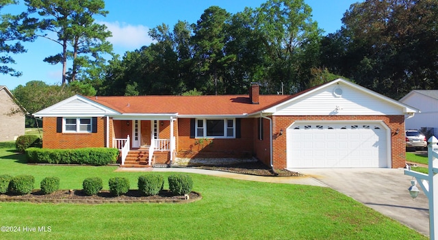 single story home with a front lawn and a garage