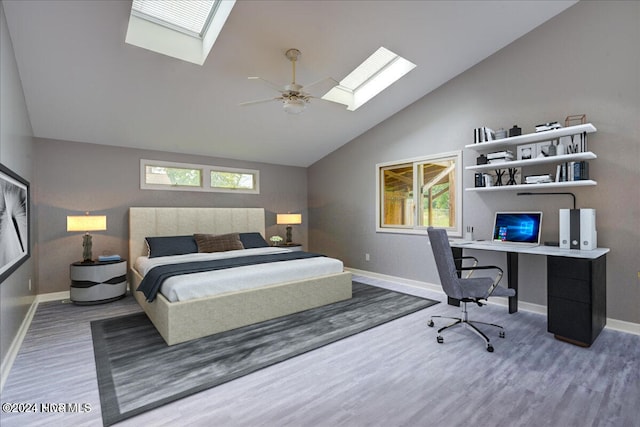 bedroom featuring ceiling fan, hardwood / wood-style floors, and high vaulted ceiling