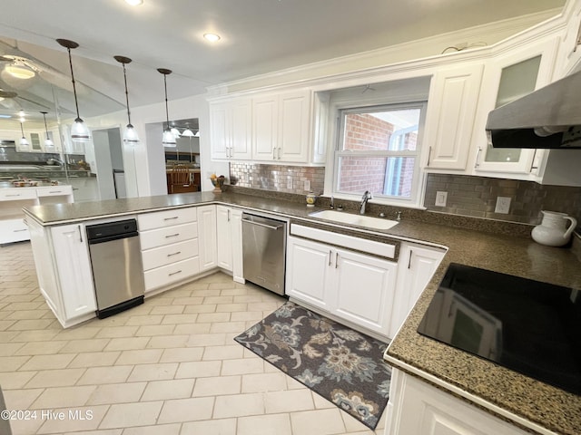 kitchen with tasteful backsplash, sink, pendant lighting, dishwasher, and white cabinets