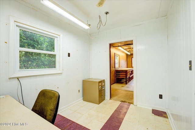 home office featuring wooden walls