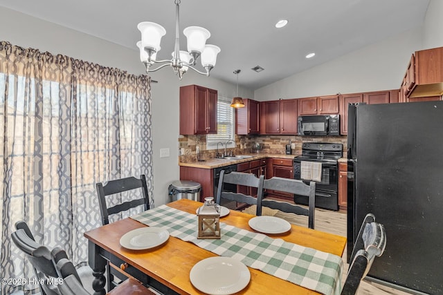 dining space with sink, light hardwood / wood-style floors, a chandelier, and vaulted ceiling