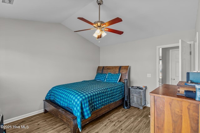 bedroom with lofted ceiling, hardwood / wood-style flooring, and ceiling fan