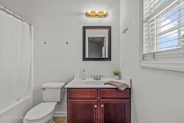 full bathroom featuring toilet, vanity, and shower / tub combo with curtain