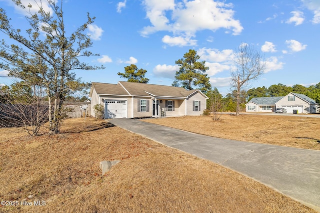 single story home with a front yard and a garage