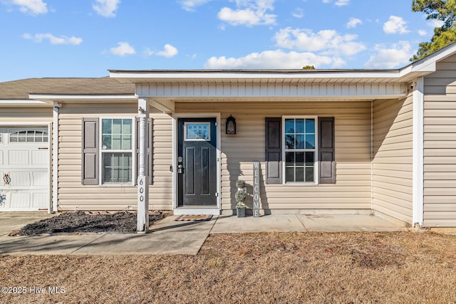 property entrance with a garage