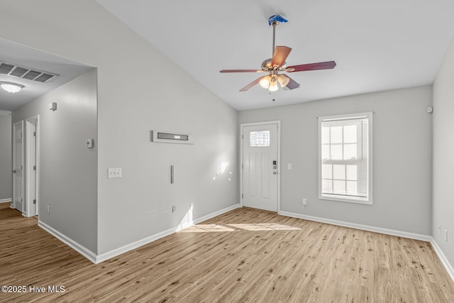 entryway featuring ceiling fan, light hardwood / wood-style flooring, and lofted ceiling