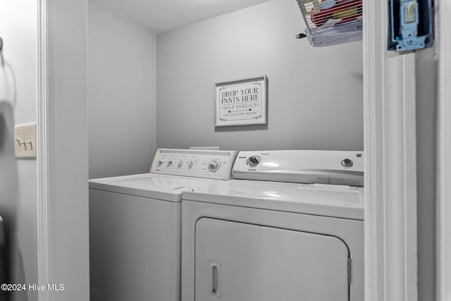 washroom with washing machine and clothes dryer