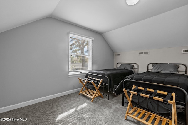 bedroom with carpet and vaulted ceiling