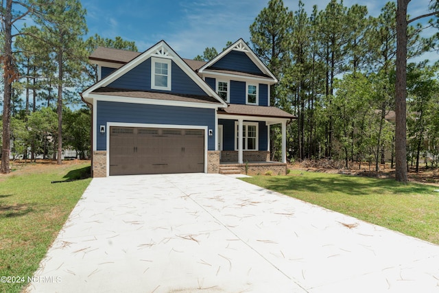 craftsman-style house with a porch, a garage, and a front lawn