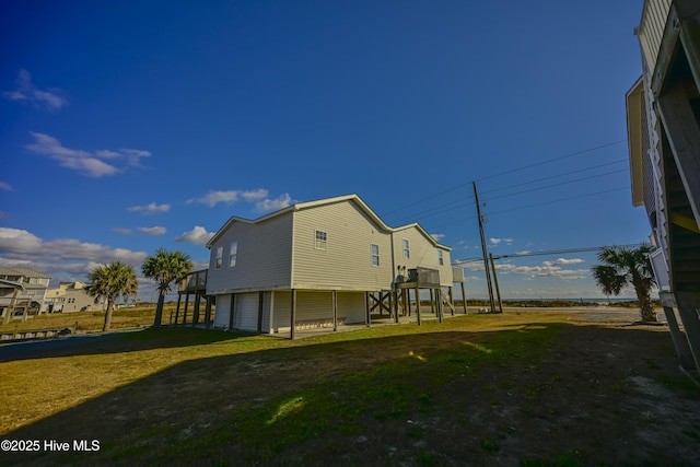 back of property featuring a yard