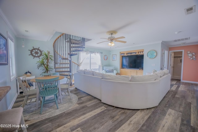 living room with ceiling fan, wood-type flooring, and crown molding