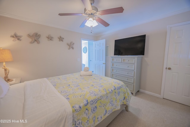 carpeted bedroom featuring ceiling fan and crown molding