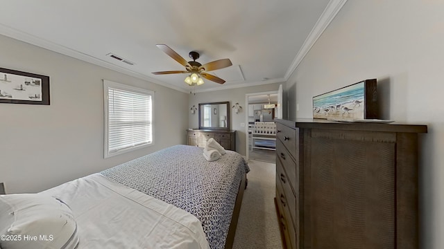 carpeted bedroom featuring ceiling fan and crown molding