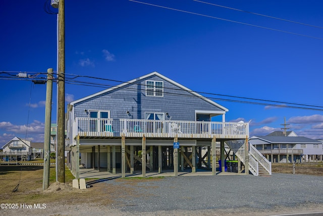 rear view of property with a wooden deck