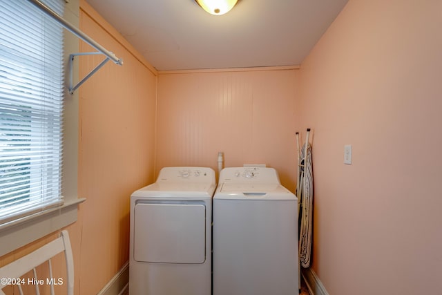 clothes washing area featuring washing machine and clothes dryer