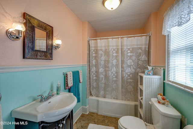 full bathroom featuring vanity, toilet, and shower / bath combo with shower curtain