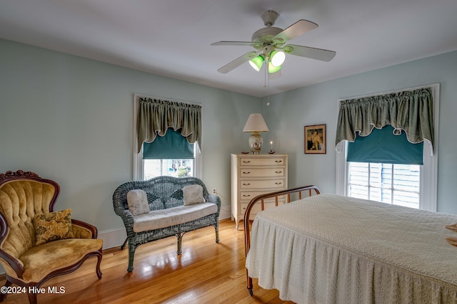 bedroom featuring light wood-type flooring and ceiling fan