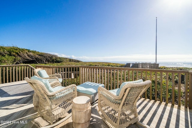 wooden terrace with a water view