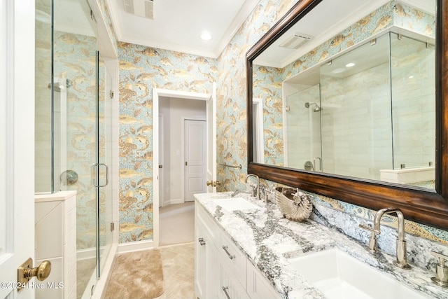 bathroom with crown molding, vanity, and walk in shower