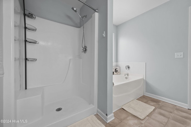 bathroom featuring tile patterned flooring and walk in shower