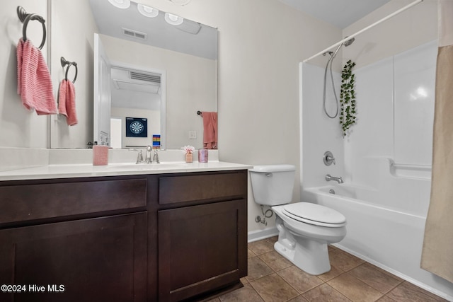 full bathroom featuring shower / tub combination, tile patterned flooring, vanity, and toilet