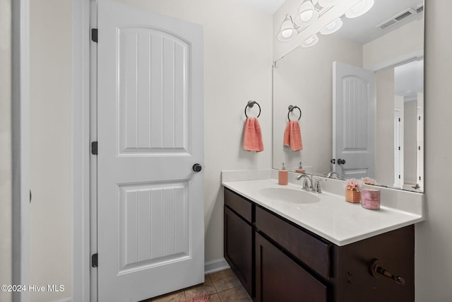 bathroom with tile patterned flooring and vanity